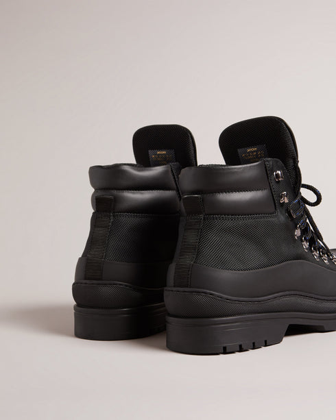 JAKSONN-Boots-Calling all adventure takers. JAKSONN are great shoes for the outdoors that don't compromise on style. The leather and nylon upper gives these boots a more refined look than your average hiking boots, while the rubber sole adds durability and traction. By purchasing this product, you are supporting responsible leather manufacturing through the Leather Working Group. Hiking boots Leather and nylon upper Rubber sole Lace up Ted Baker branded Padded ankle Comes in Ted Baker branded packaging- Ted